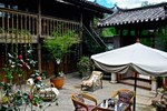 Отель Sleepy Inn Lijiang Отель Sleepy Inn Lijiang