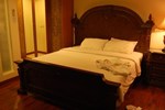 Отель The Pejaten Suites Отель The Pejaten Suites